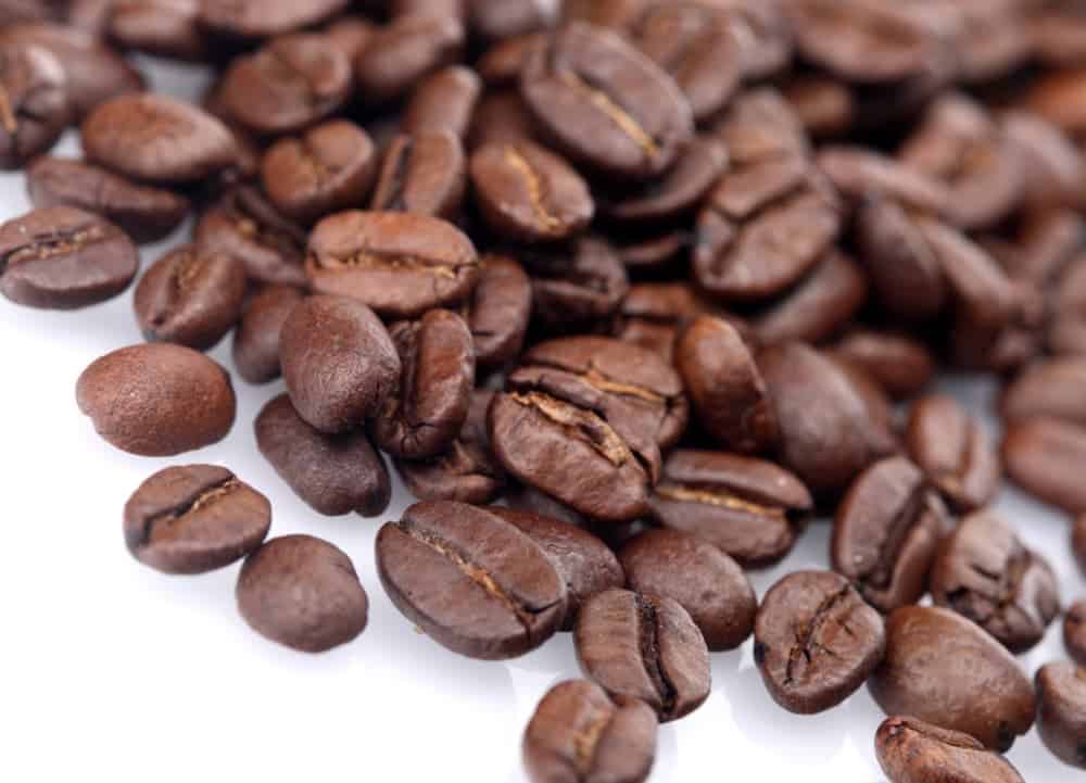 coffee beans on white table top