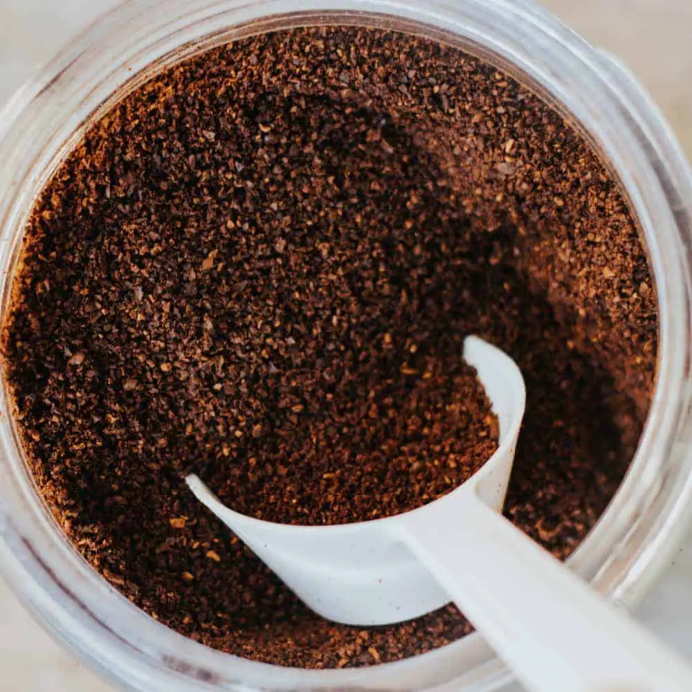 coffee grounds with white scoop