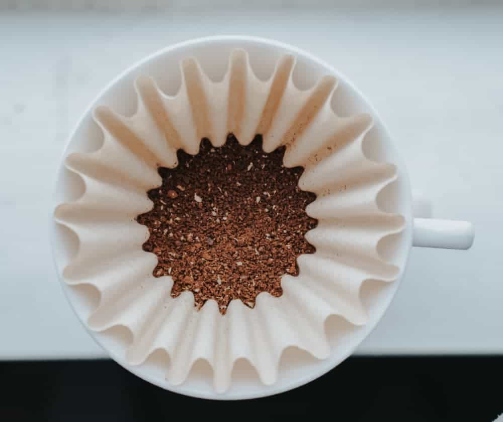 coffee grounds in filter in mug