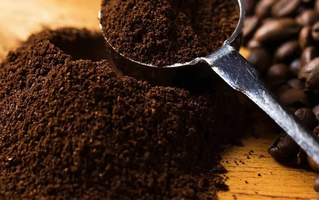 coffee grounds on wooden table