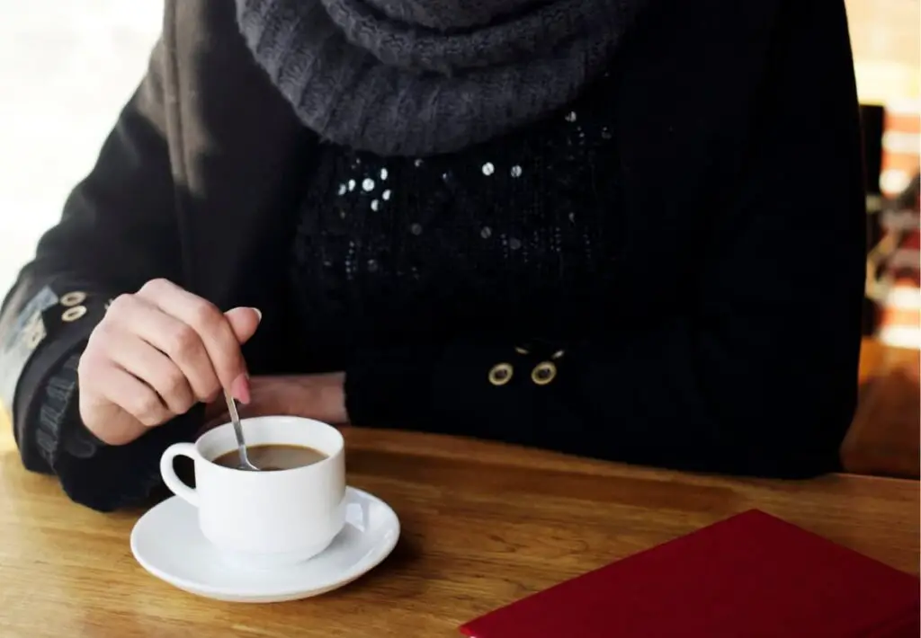 woman stirring coffee