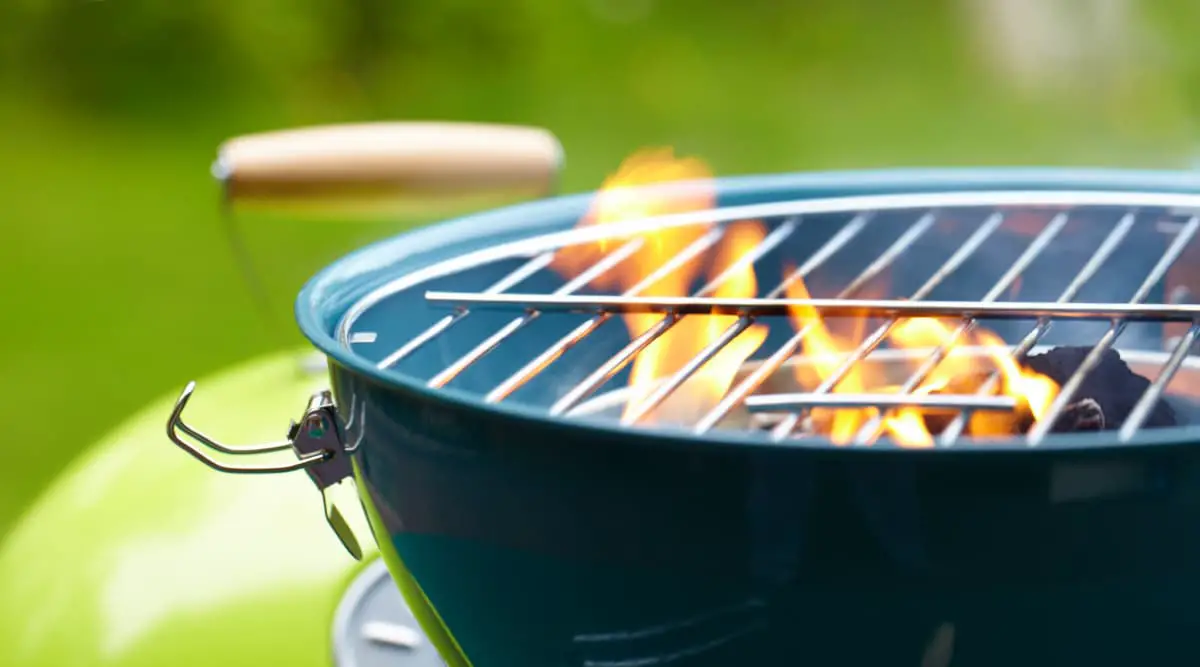 black barbeque grill with open flames