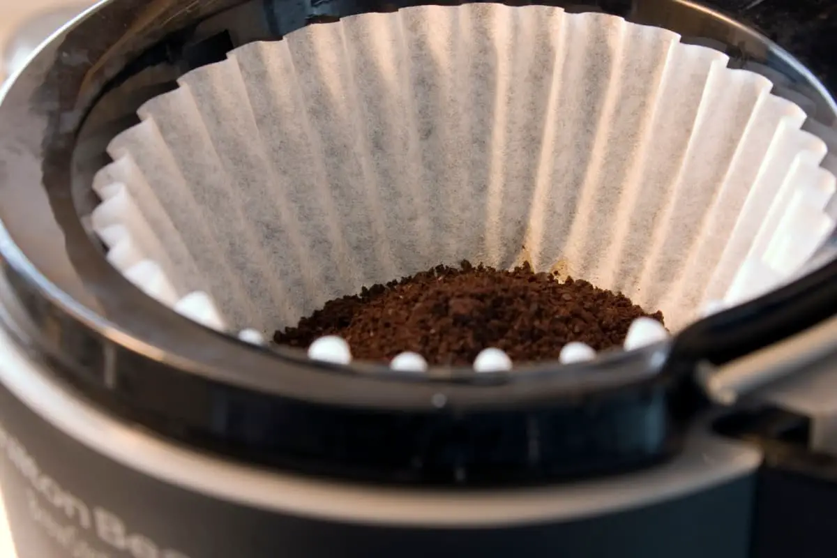 coffee filter in coffee machine with grounds added