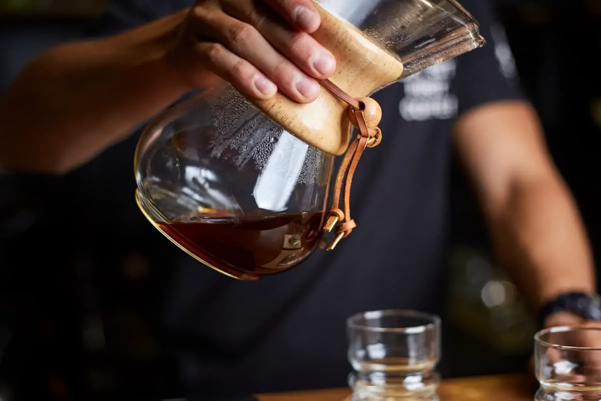 man making pour over coffee