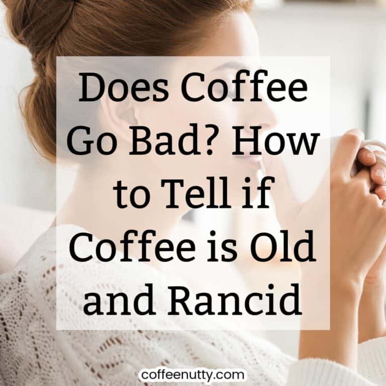 Woman in bun smelling cup of coffee in white mug.