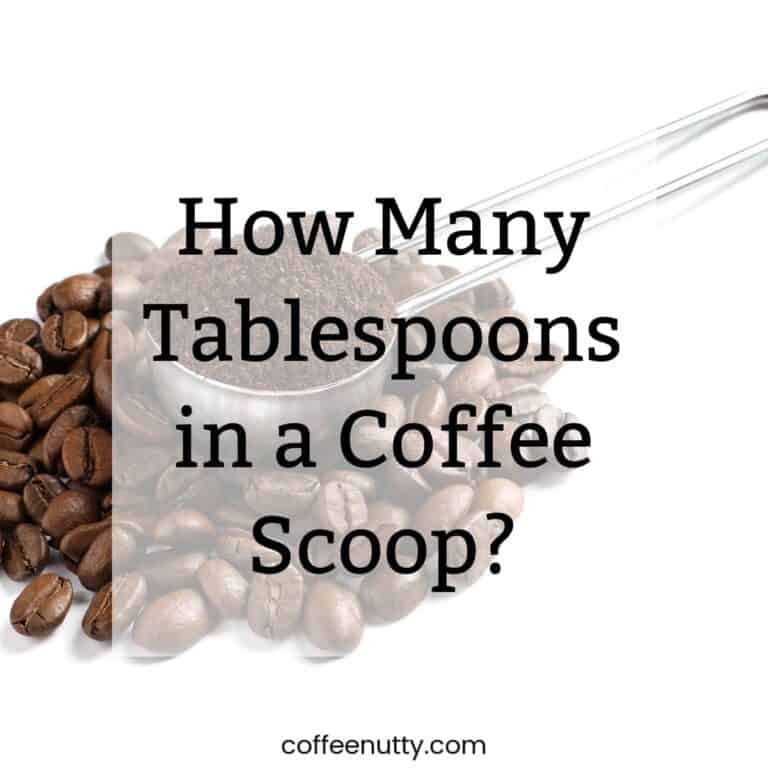 Coffee scoop with ground coffee with text overlay reading "how many tablespoons in a cup of coffee?"