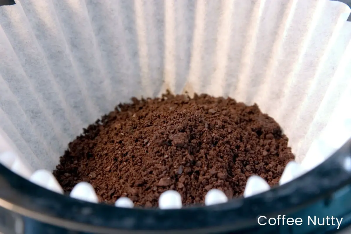 Close-up of coffee grounds in coffee filter just before brewing.