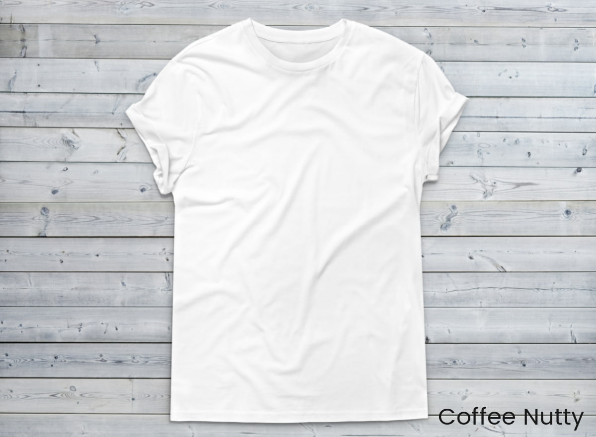 White t-shirt on gray washed wood.