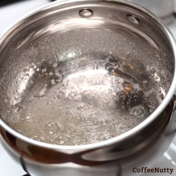 Boiling sugar and water to make classic syrup.