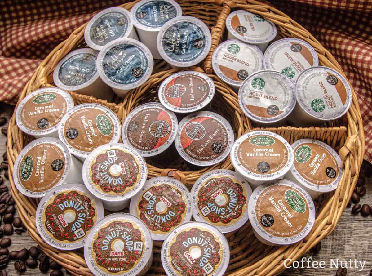 Various coffee pods in a wicker storage basket on the counter.