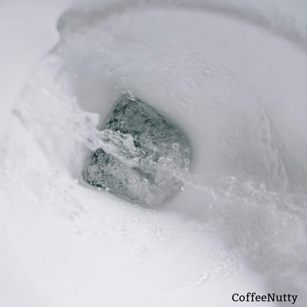 Water flushing down toilet - coffeenutty.com.