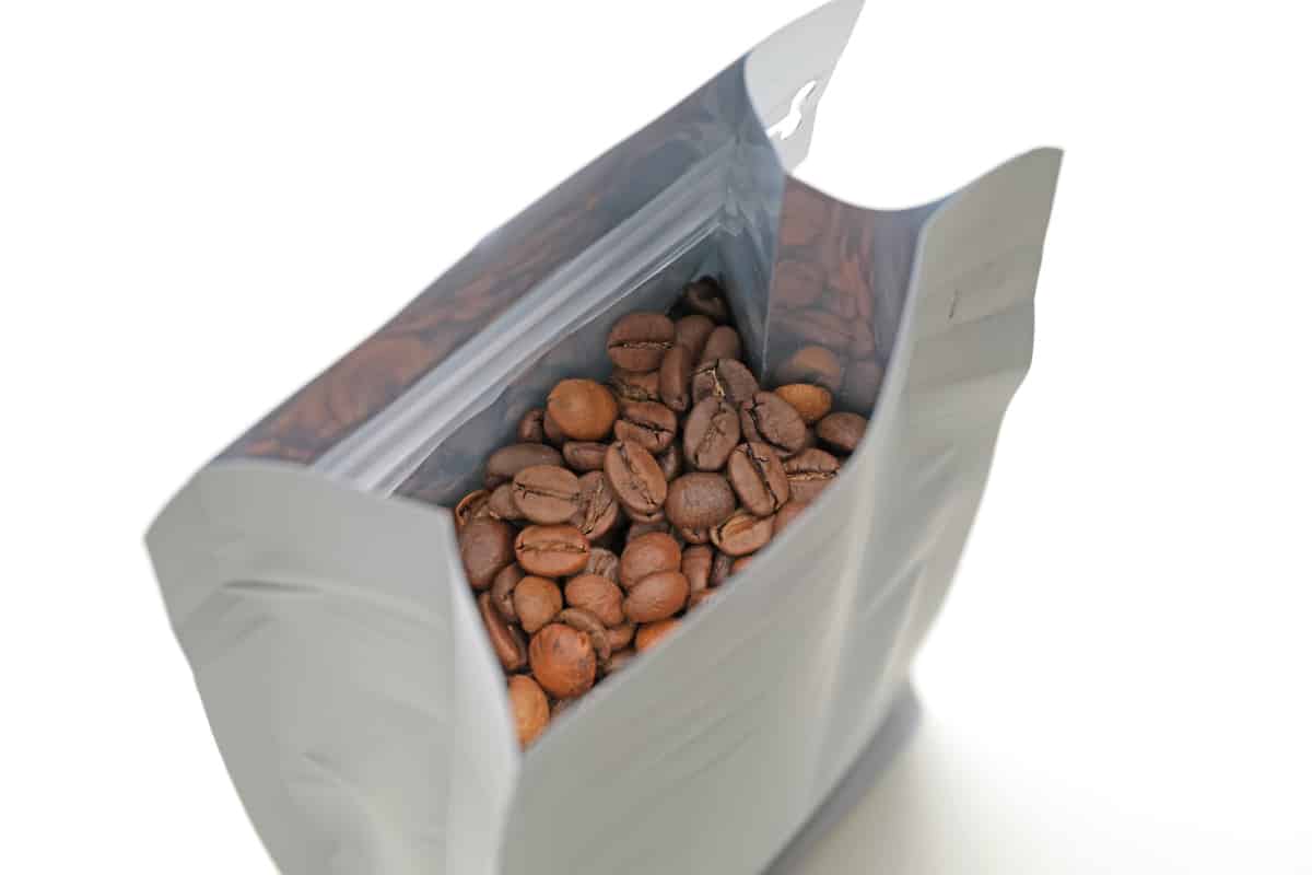 Opened bag of coffee beans.