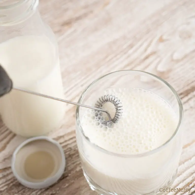 Frothing milk with milk frother.