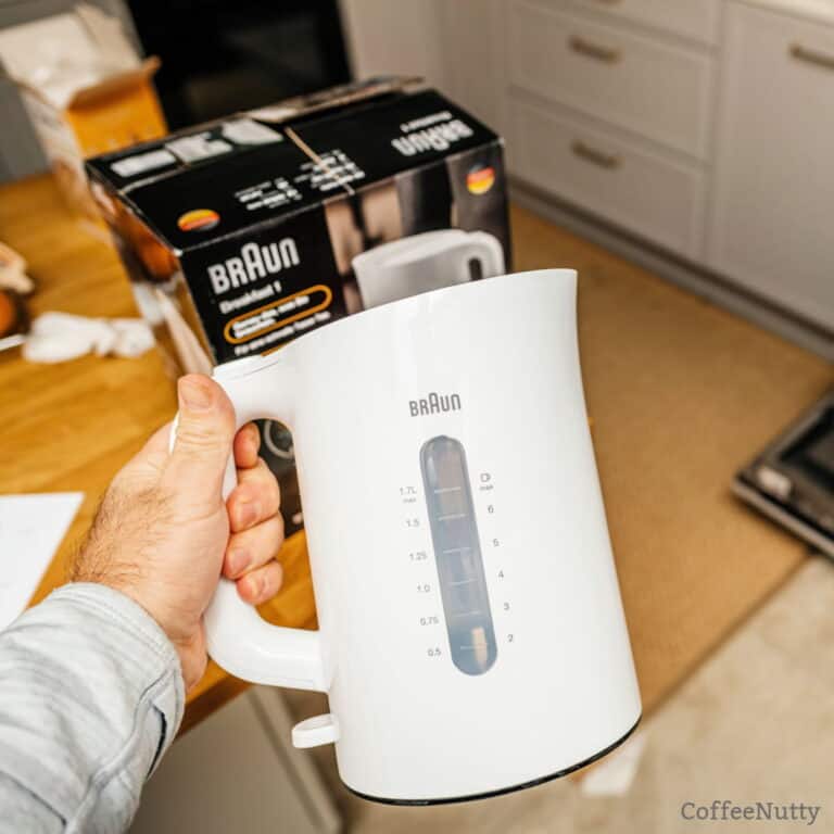 Man getting ready to clean a Braun coffee machine.