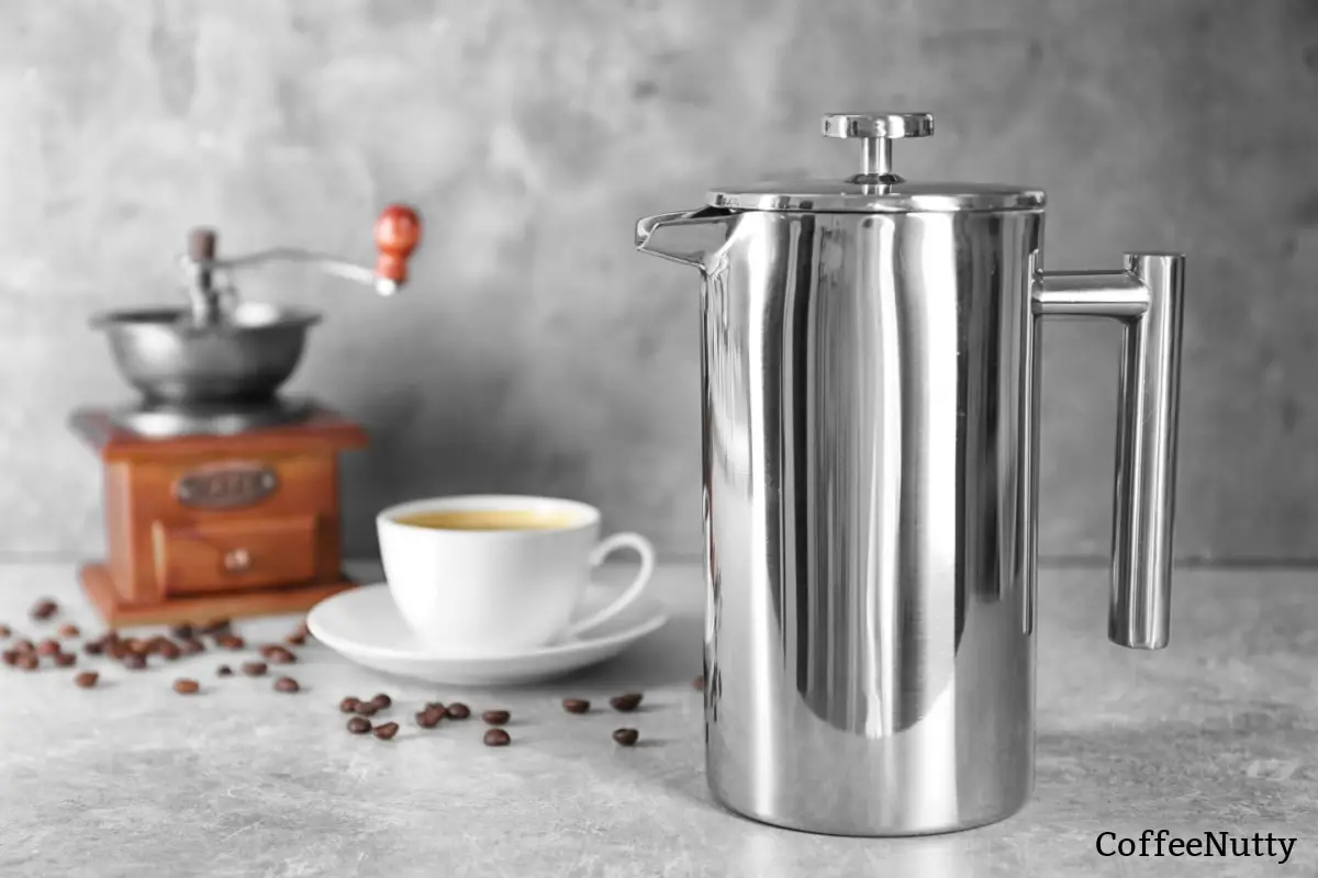 Stainless steel coffee percolator sitting on kitchen counter.