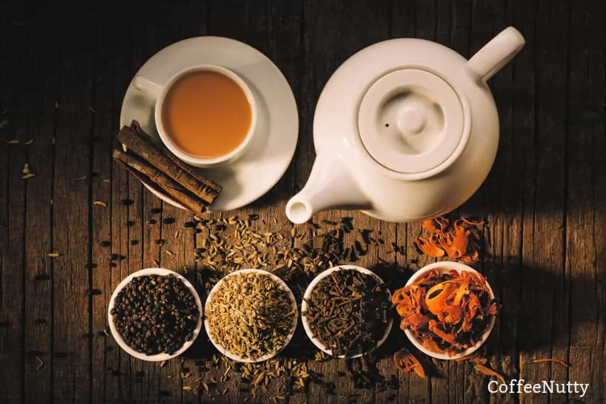 Various herbal teas and spices on wooden table.