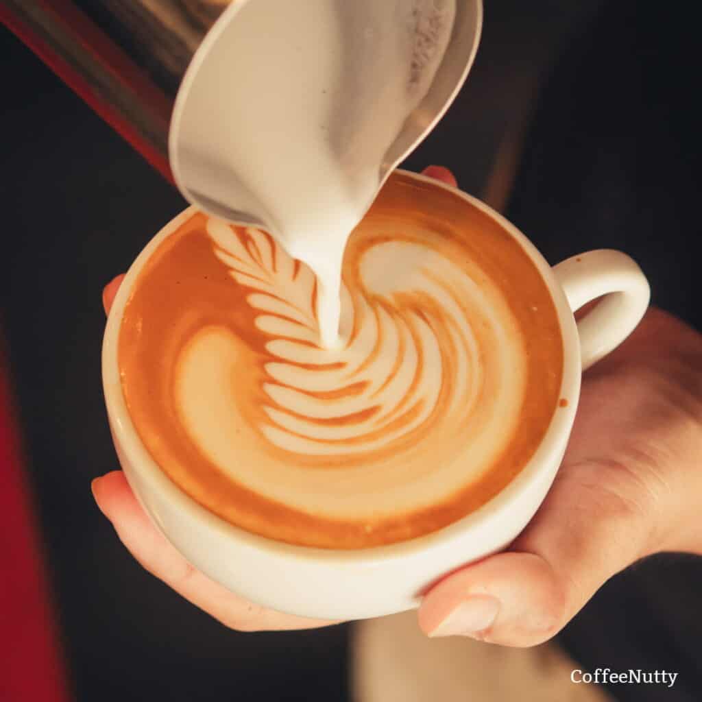 Milk frothed for coffee latte art.